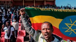 A man holds an Ethiopian national flag during a blood donation rally organised by the city administration of Addis Ababa, in Addis Ababa, on November 12, 2020. - Hundreds of Ethiopians gathered in the capital on November 12, 2020, to donate blood for troops fighting in the northern Tigray region, as officials tried to rally support for a conflict Prime Minister Abiy Ahmed said was going his way. (Photo by EDUARDO SOTERAS / AFP) (Photo by EDUARDO SOTERAS/AFP via Getty Images)