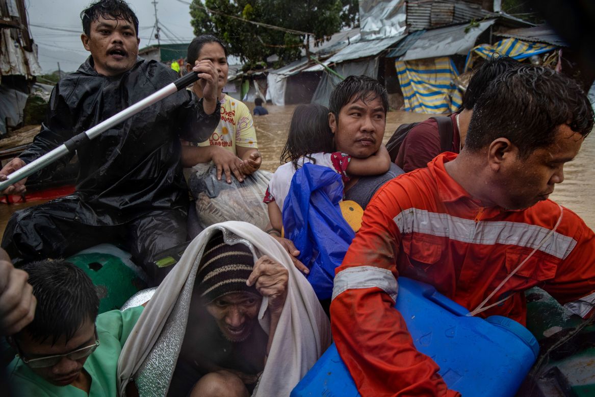 People ride a rubber boat after being rescued from a submerged village in Rodriguez, Philippines, on Thursday, November 12. <a href="https://www.cnn.com/2020/11/12/asia/typhoon-vamco-philippines-intl/index.html" target="_blank">Typhoon Vamco battered the Philippines,</a> causing widespread flooding.
