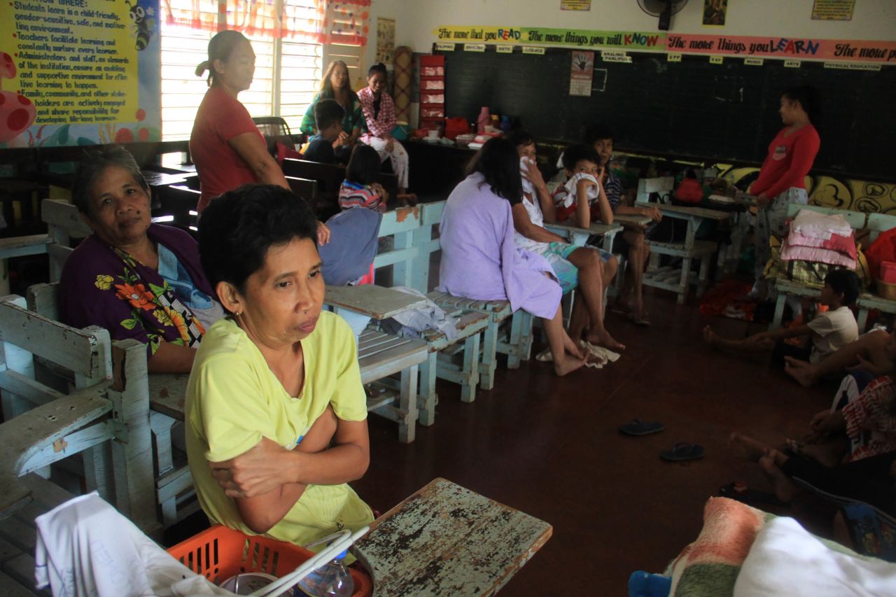 Residents take shelter in a classroom that was being used as an evacuation center in Camalig on Wednesday, November 11.