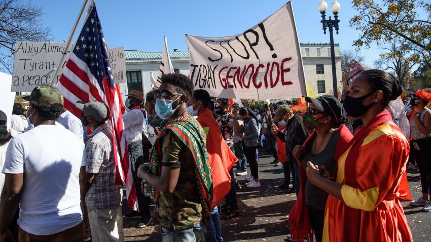 Ethiopians call for the end of the government's military actions in the northern Tigray region in front of the US State Department in Washington, DC, on November 9, 2020. - Clashes broke out between the federal military forces and local security units in the northern region of Tigray, where the ruling party has defied the authority of Prime Minister Abiy Ahmed. (Photo by NICHOLAS KAMM / AFP) (Photo by NICHOLAS KAMM/AFP via Getty Images)