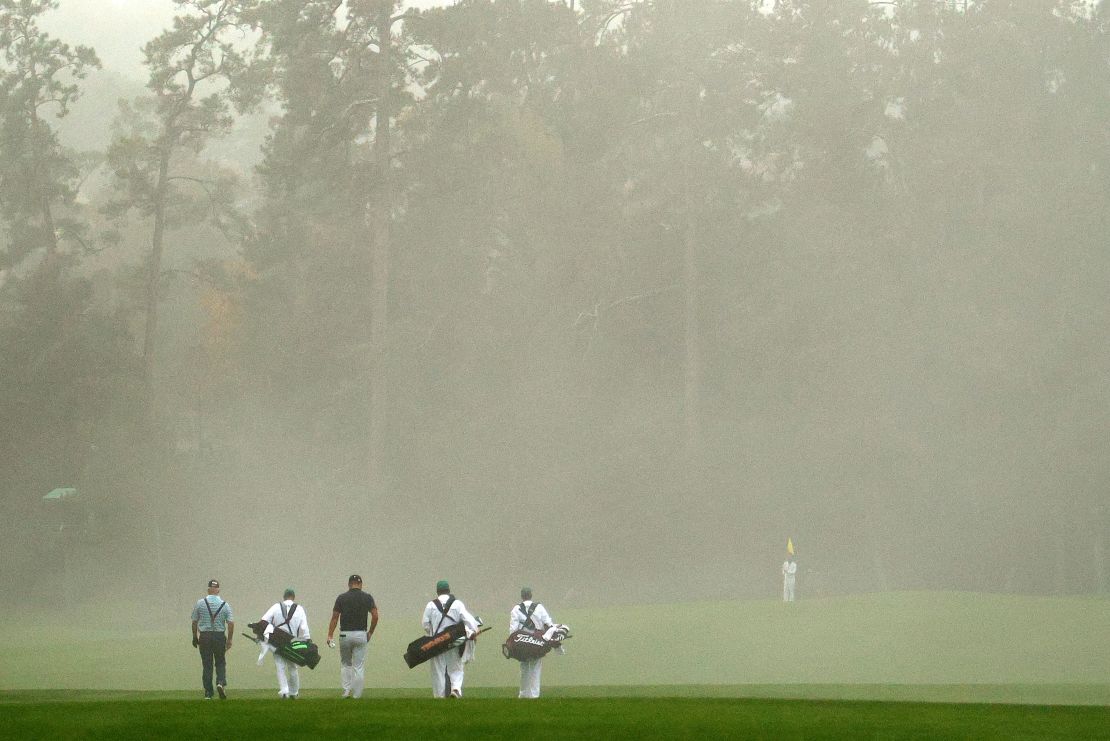 Sandy Lyle, Jimmy Walker and amateur Yuxin Lin walk up the tenth fairway during the first round of the Masters.