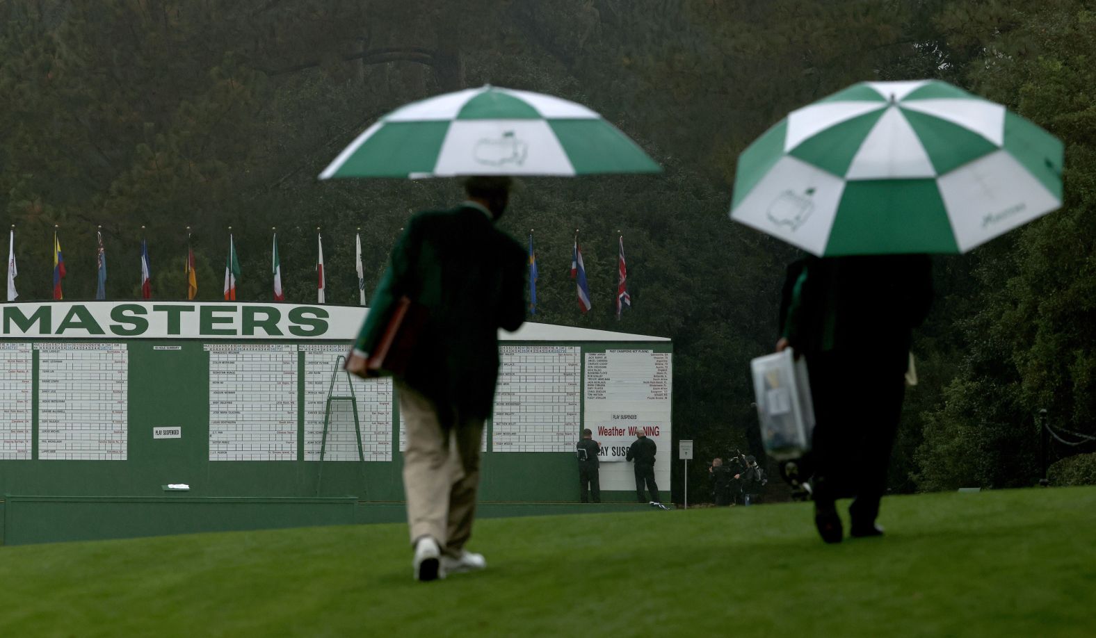 The scoreboard is updated with a "Weather Warning" and "Play Suspended" sign after lightning and rain caused play to be halted after just 30 minutes on the first day. 