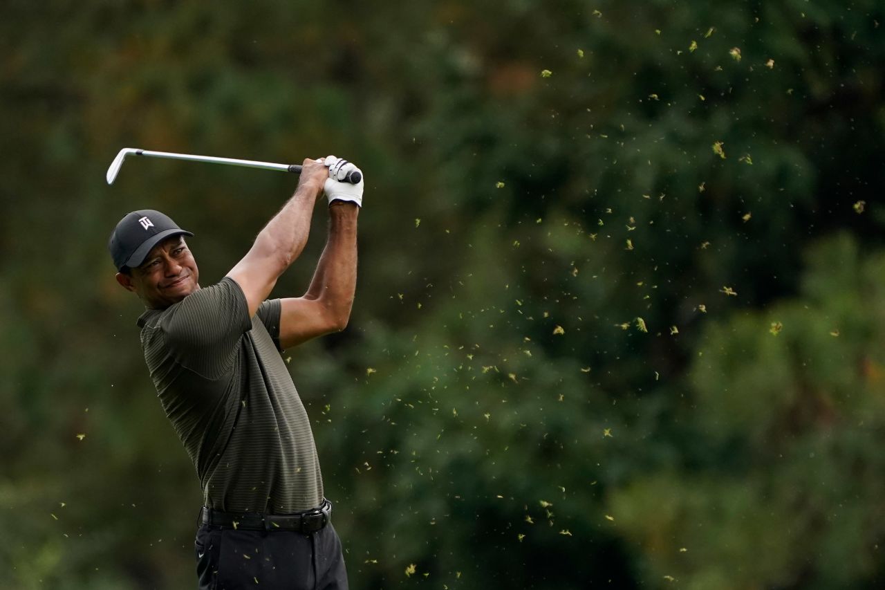 Tiger Woods hits from the 15th fairway during the first round of the Masters. He finished four-under par.
