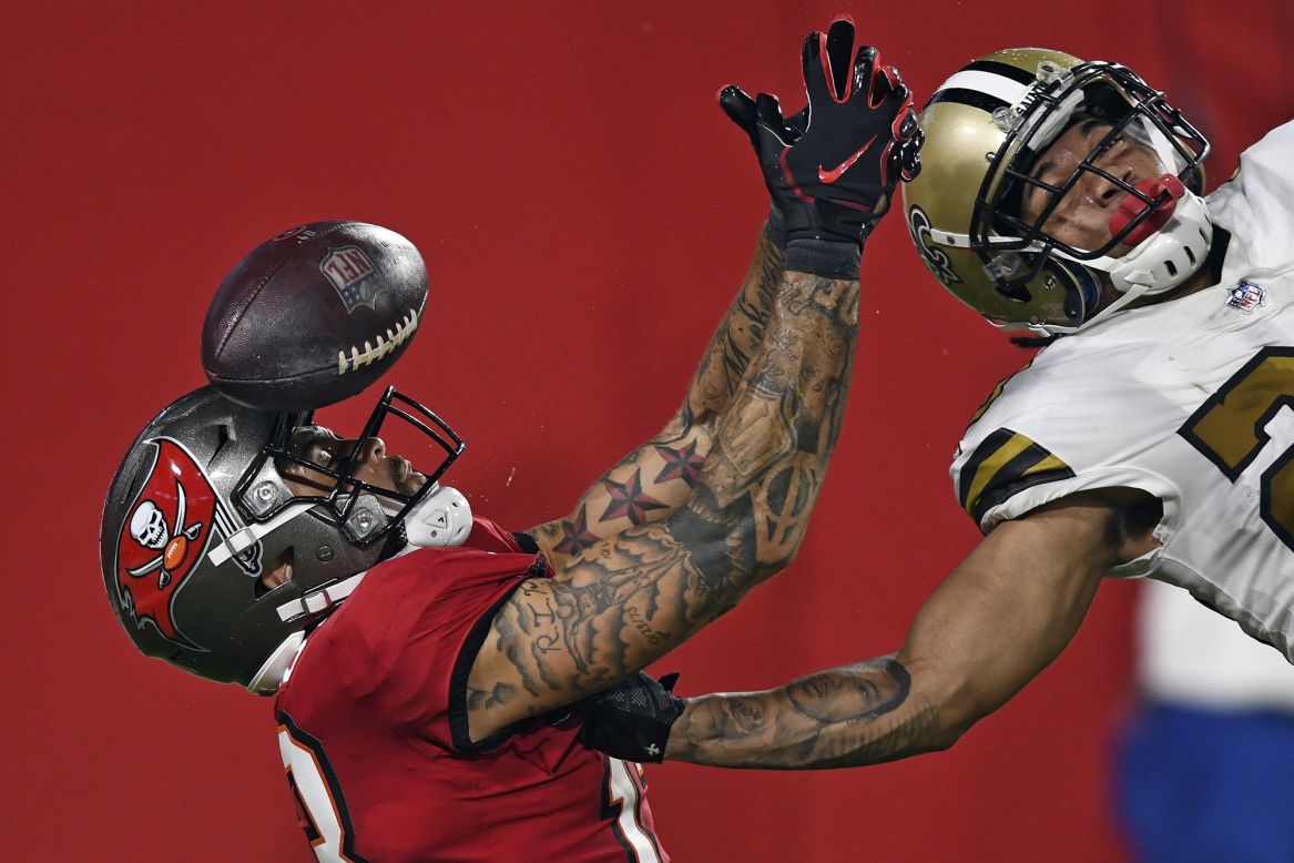 Tampa Bay wide receiver Mike Evans, left, is defended by New Orleans' Marshon Lattimore during an NFL game in Tampa, Florida, on Sunday, November 8. 