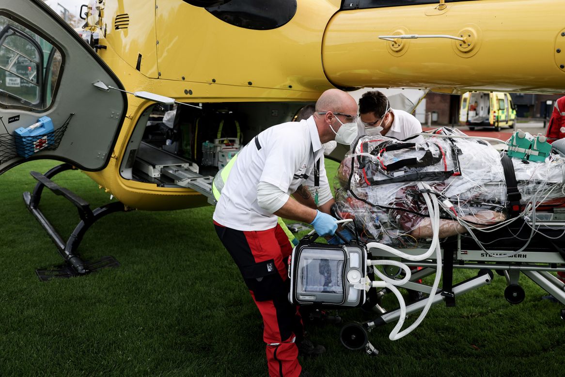 Medics prepare to load a Covid-19 patient into a helicopter in Verviers, Belgium, on Monday, November 9.