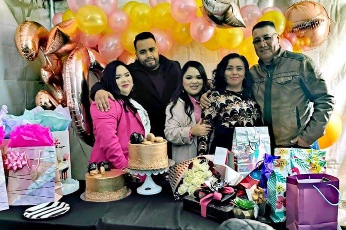 Sergio with his twin sisters and parents at the sisters' 30th birthday.