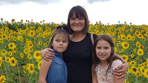 Juanita Dutton (center), a single mom from Lawrence, Kansas, was forced to leave her job to care for daughters Mia (left), 10, and Kaycee (right), 8, during the pandemic shutdown.