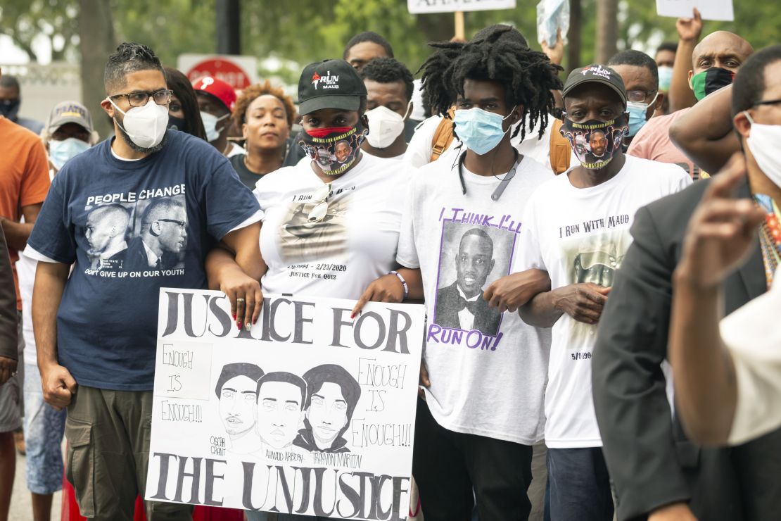 Ahmaud Arbery's aunt Theawanza Brooks, center left, joins family members and supporters for a march in Glynn County on May 16 after a rally to protest his shooting.
