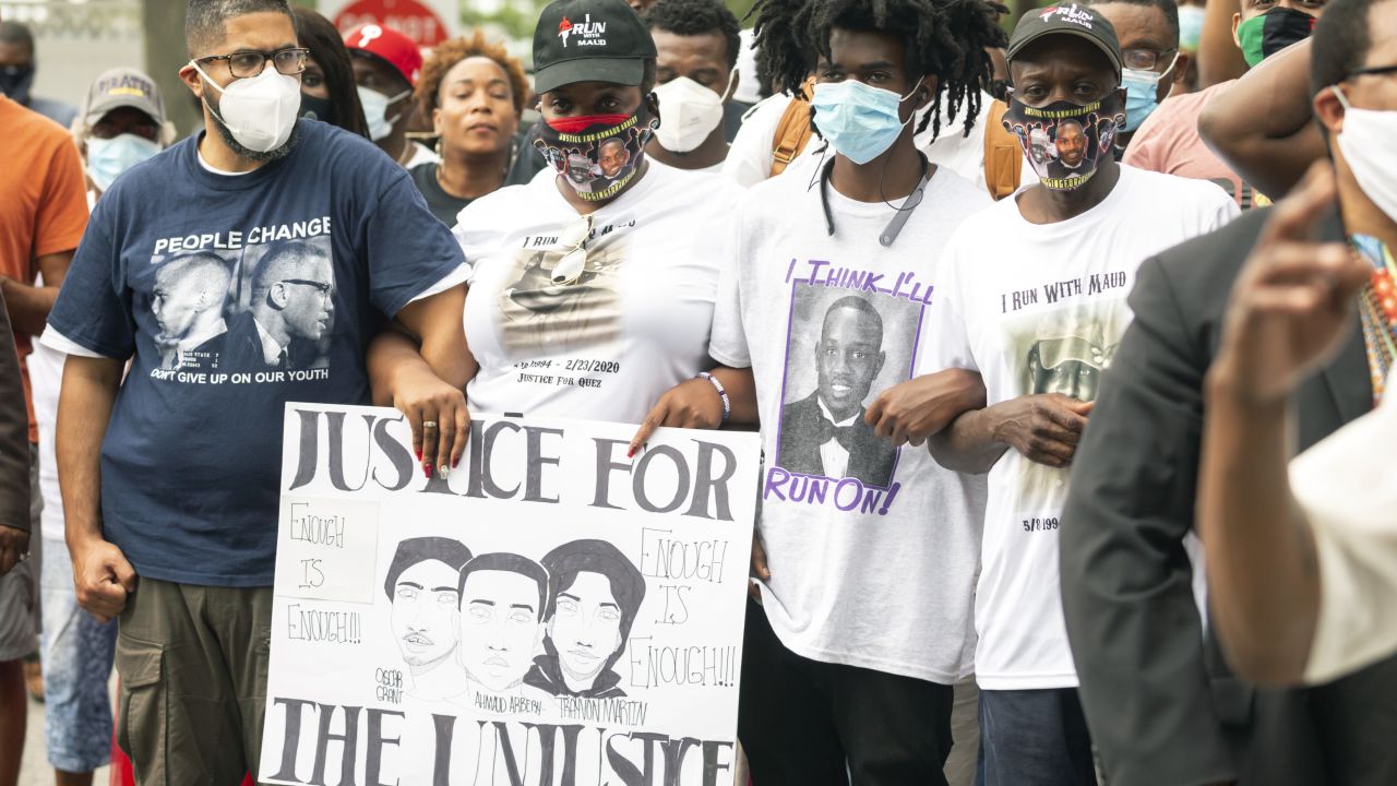 Ahmaud Arbery's aunt Theawanza Brooks, center left, joins family members and supporters for a march in Glynn County on May 16 after a rally to protest his shooting.