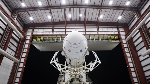 A SpaceX Falcon 9 rocket with the company's Crew Dragon spacecraft onboard is seen as it is rolled out of the horizontal integration facility at Launch Complex 39A as preparations continue for the November Crew-1 mission.