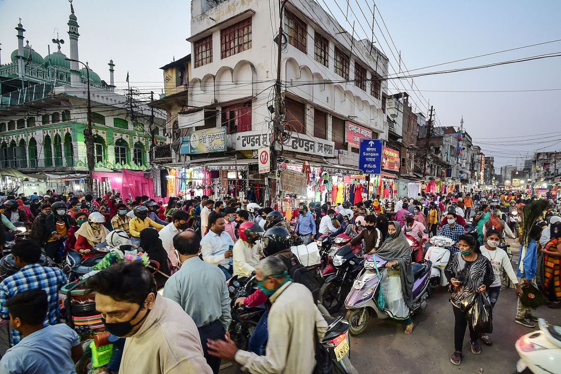 People gather at a market for shopping ahead of Diwali or the Hindu festival of light in Allahabad on November 12, 2020.