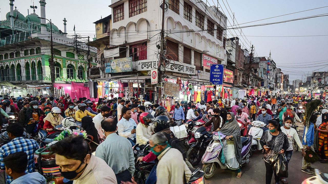 People gather at a market for shopping ahead of Diwali or the Hindu festival of light in Allahabad on November 12, 2020.