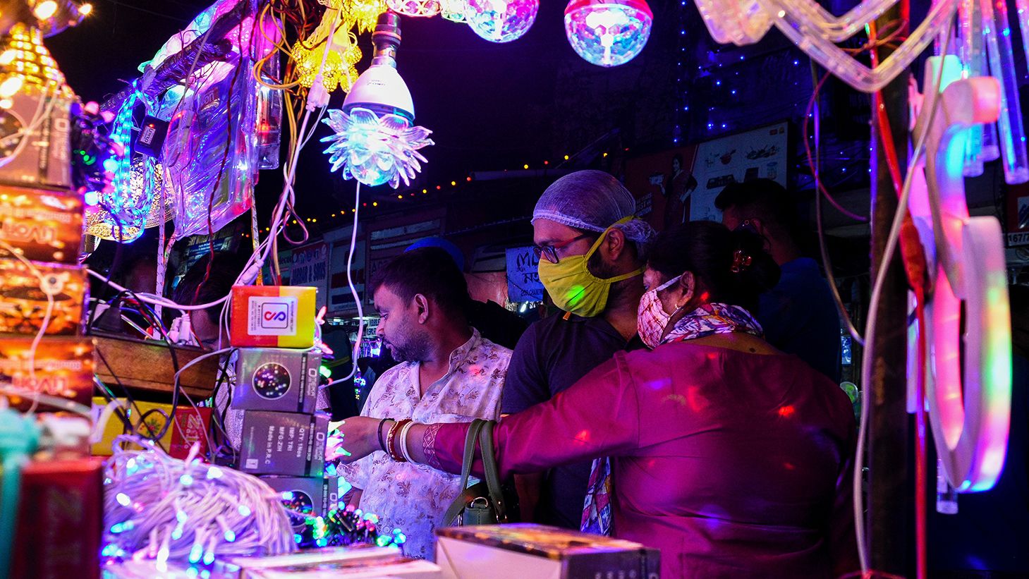 A couple shopping for decorative lights at a market in Kolkata.