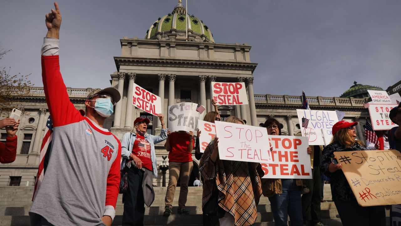 Dozens of people calling for stopping the vote count in Pennsylvania due to alleged fraud against President Donald Trump gather on the steps of the State Capitol on November 5 in Harrisburg, Pennsylvania. 