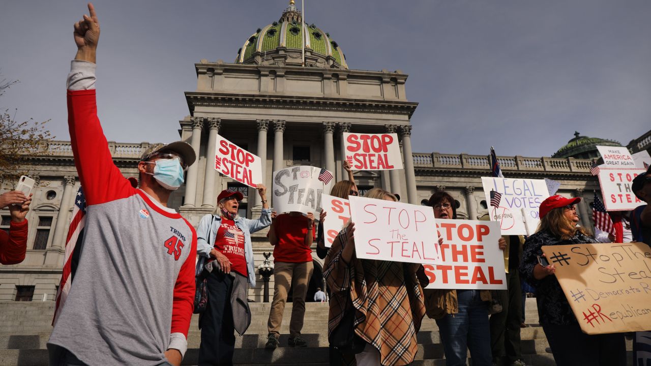 Dozens of people calling for stopping the vote count in Pennsylvania due to alleged fraud against President Donald Trump gather on the steps of the State Capitol on November 5 in Harrisburg, Pennsylvania.