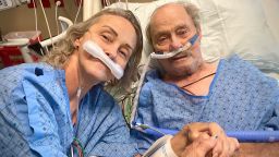 Tracy Larsen, 56, with her father, 80-year-old Burt Porter share a moment together at an ICU ward shortly before losing their battles with Covid-19.