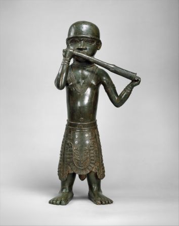 The earliest Benin Bronzes date back to the 11th century and remained in the Kingdom for almost a millennium. This brass figure of a horn-blower was made in the 16th century. 