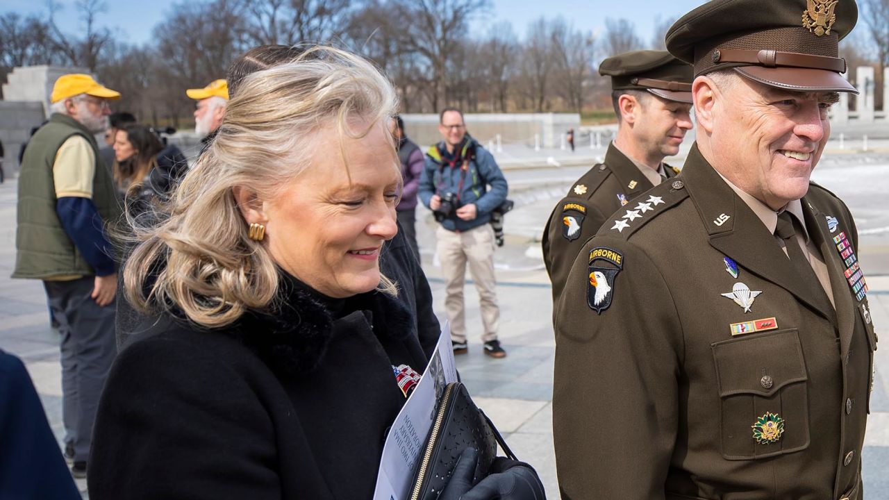 Chairman of the Joint Chiefs of Staff General Mark A. Milley (R) and his wife Hollyanne Milley (L) participate in the Battle of Iwo Jima 75th Anniversary Commemoration at the World War II Memorial in Washington, DC, USA, 19 February 2020. 