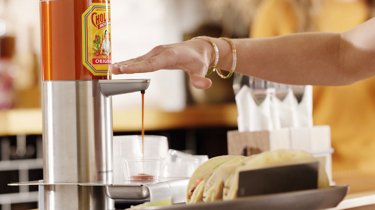 The new hands-free Cholula dispenser