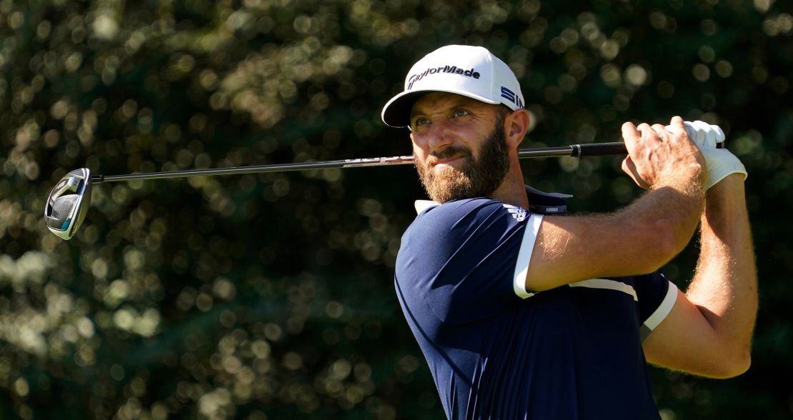 Dustin Johnson watches his tee shot on the 14th hole during the second round of the Masters golf tournament.