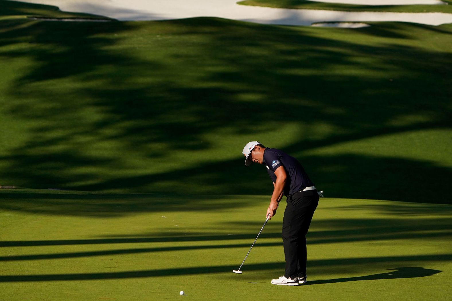 Sungjae Im, of South Korea, putts on the 10th hole on his way to a 12-under tally and joint second place after three rounds.