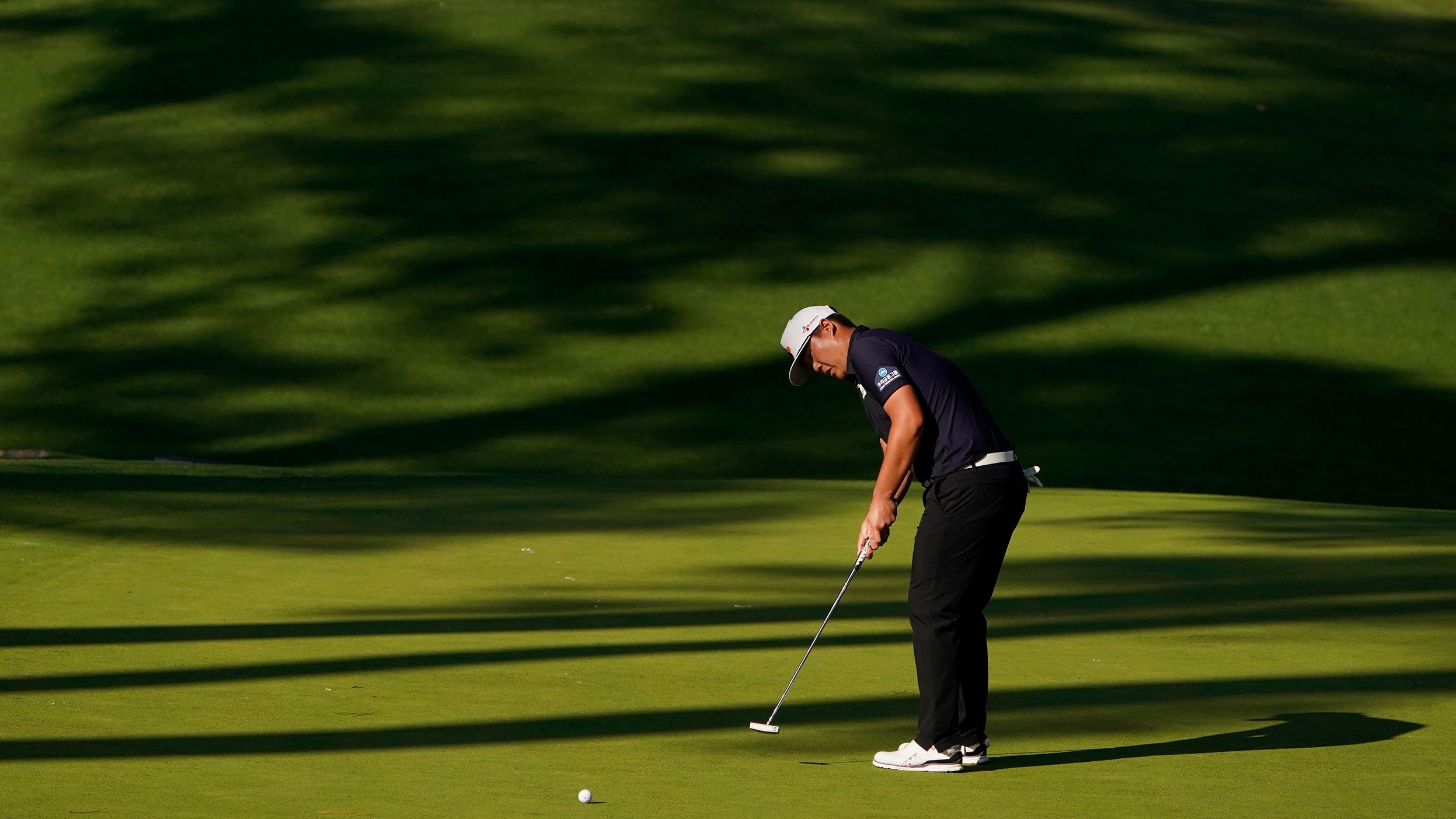 Sungjae Im, of South Korea, putts on the 10th hole on his way to a 12-under tally and joint second place after three rounds.