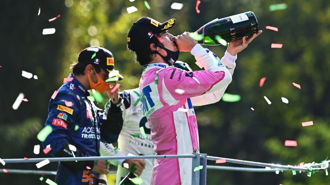 Lance Stroll (right) celebrates on the podium at this year's Italian GP.