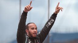 Mercedes' British driver Lewis Hamilton celebrates winning the race and the 7th world championship after the Turkish Formula One Grand Prix at the Intercity Istanbul Park circuit in Istanbul on November 15, 2020. (Photo by TOLGA BOZOGLU / POOL / AFP) (Photo by TOLGA BOZOGLU/POOL/AFP via Getty Images)