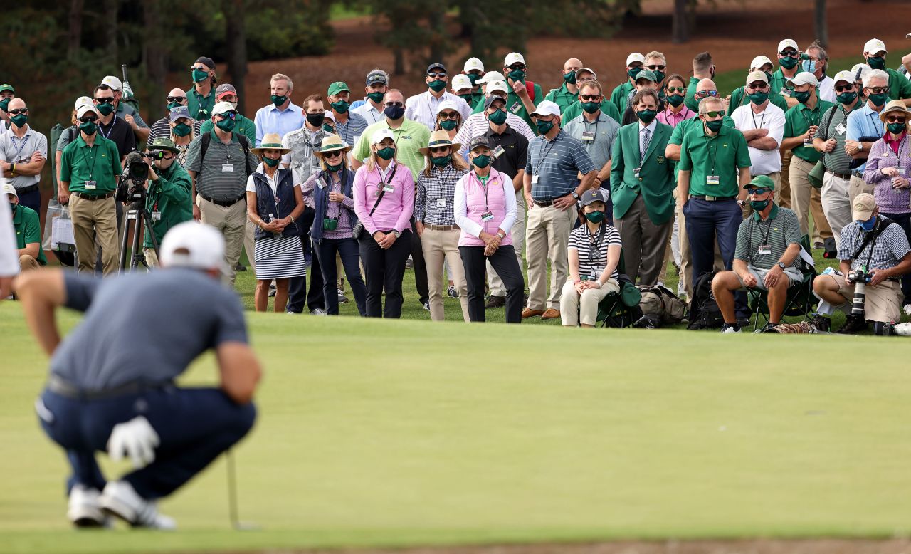 A view of the gallery as Dustin Johnson of the United States lines up a putt on the 18th green before claiming victory.