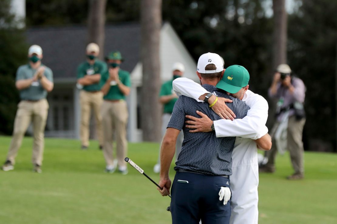 Johnson celebrates with his brother and caddie Austin.