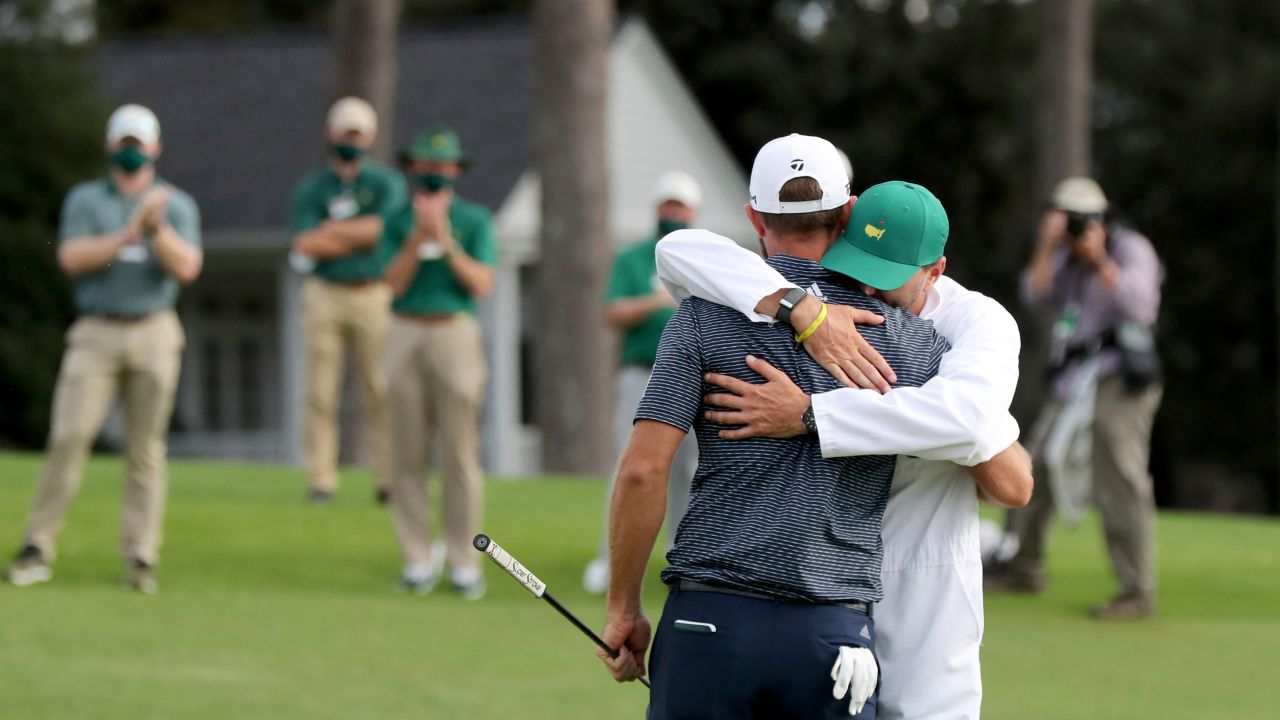 Johnson celebrates with his brother and caddie Austin.