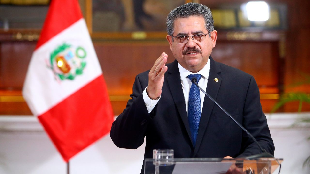 In this photo released by Peru's Presidential Palace, Peru's interim president Manuel Merino announces his resignation via a televised address from the Presidential Palace in Lima, Peru, Sunday, Nov. 15, 2020.