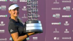 Danish golfer Emily Kristine Pedersen celebrates with the trophy after winning the Saudi Ladies International golf tournament on November 15, 2020, at the King Abdullah Economic City, north of Jeddah. (Photo by Amer HILABI / AFP) (Photo by AMER HILABI/AFP via Getty Images)
