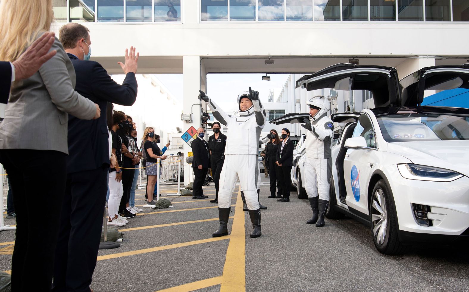 Noguchi prepares to depart the Neil Armstrong Operations and Checkout Building with his crewmates to board the SpaceX Crew Dragon spacecraft.