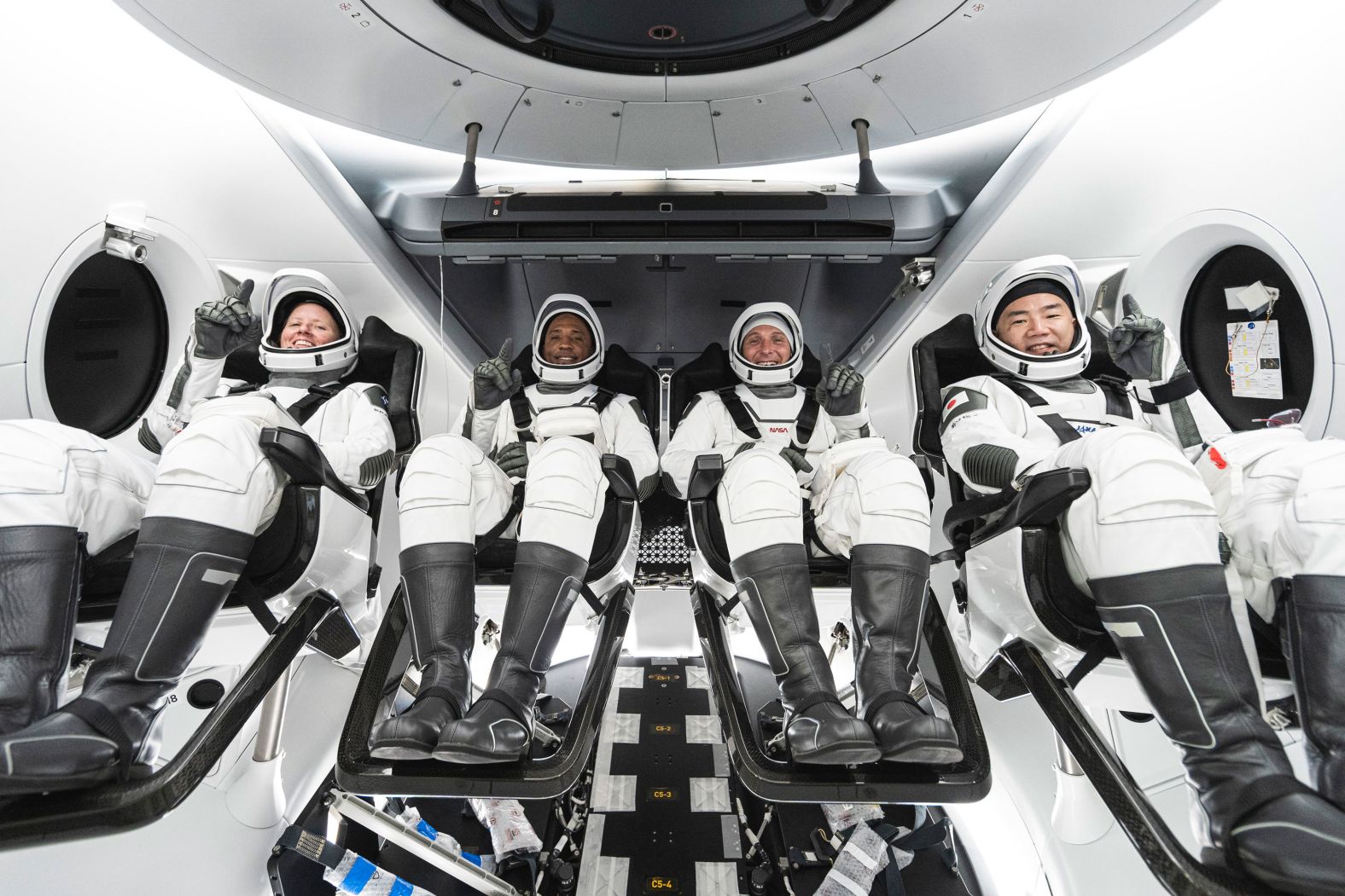 This undated photo released by SpaceX in September shows Walker, Glover, Hopkins and Noguchi inside SpaceX's Crew Dragon spacecraft.