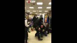 Belarus police beat protesters in a supermarket in the capital city of Minsk.