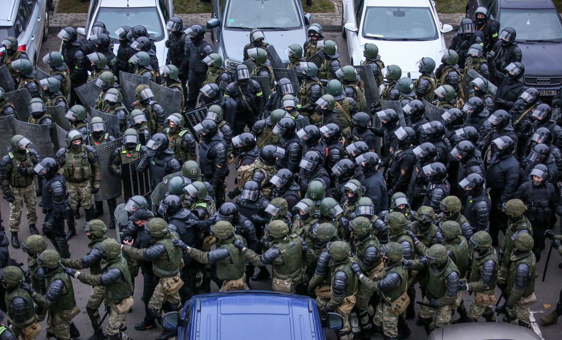 Law enforcement officers gather to disperse opposition supporters during a rally to protest against the Belarus presidential election results in Minsk, on November 15.