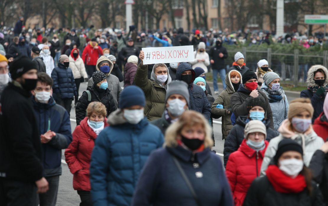 Belarus opposition supporters wearing face masks attend a rally to protest against the Belarus presidential election results in Minsk, on November 15.