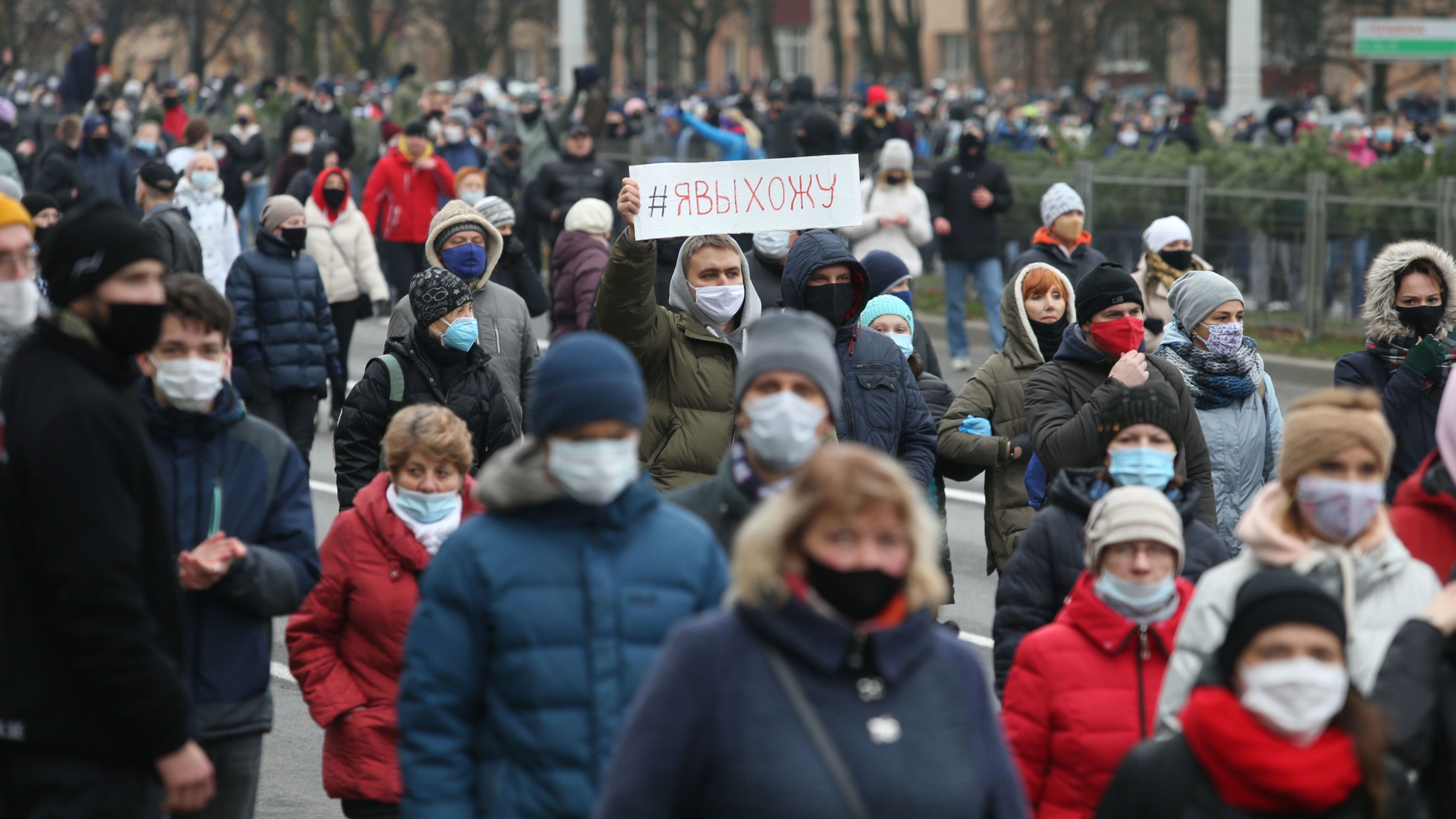 Belarus opposition supporters wearing face masks attend a rally to protest against the Belarus presidential election results in Minsk, on November 15.