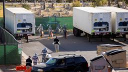 El Paso County detention inmates, also known as ?trustees? (low level inmates) help move bodies to refrigerated trailers deployed during a surge of coronavirus disease (COVID-19) deaths, outside the Medical Examiner's Office which is located next to a cemetary in El Paso, Texas, U.S. November 14, 2020. Picture taken November 14, 2020.  REUTERS/Ivan Pierre Aguirre  TV OUT.  NOT FOR SALE TO TELEVISION BROADCASTERS