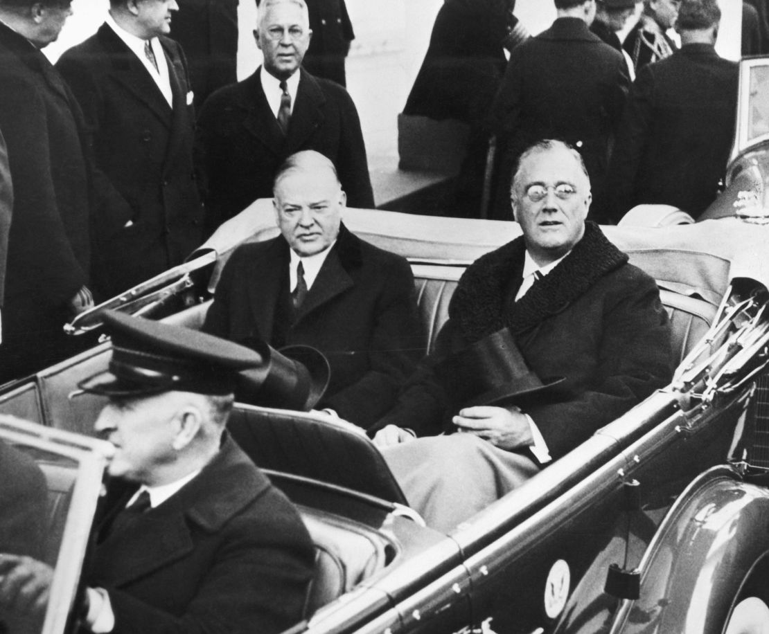 On the day of Franklin Delano Roosevelt's presidential inauguration in 1933, he rides with his predecessor Herbert Hoover to the ceremony.