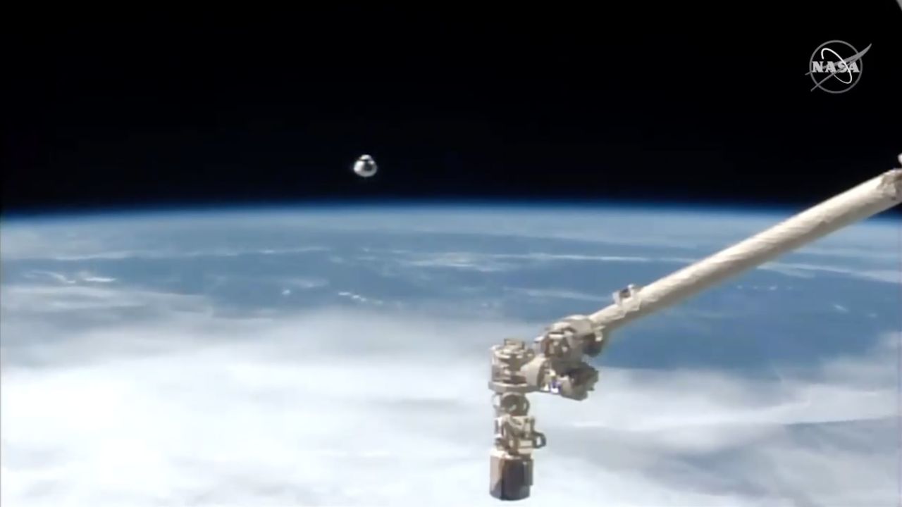 The crew's capsule is seen approaching the ISS.