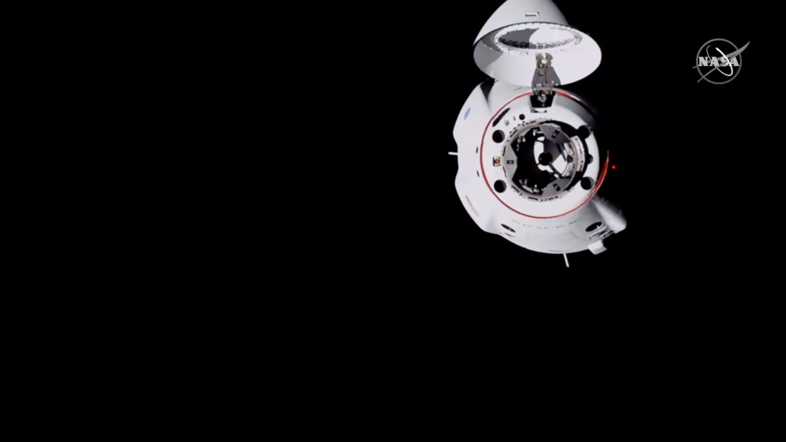 The SpaceX Crew Dragon capsule waits to dock the ISS.