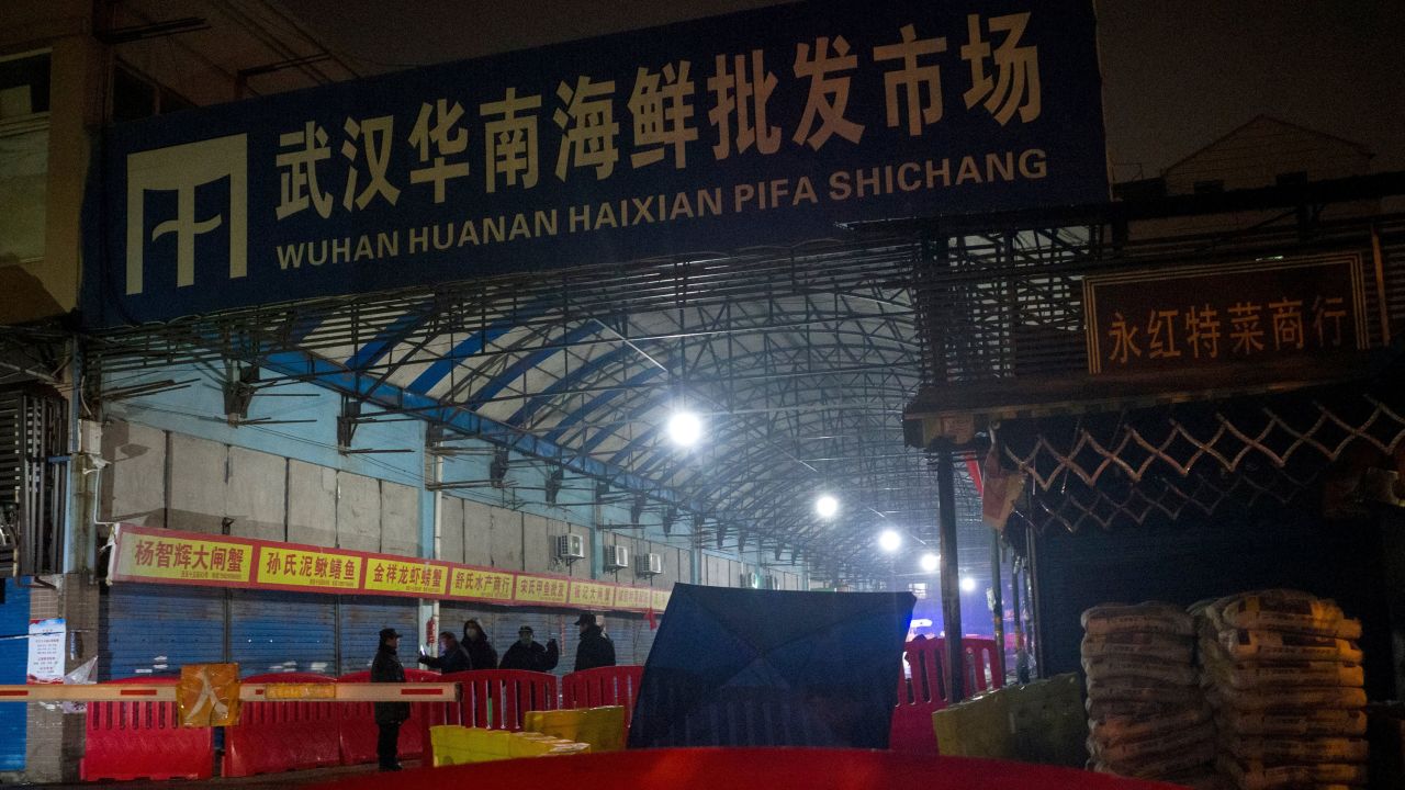 Security guards stand in front of the closed Huanan Seafood Wholesale Market in the city of Wuhan, in the Hubei Province, on January 11.