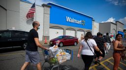 People past walk by a Walmart store on August 23, 2020 in North Bergen, New Jersey. Walmart saw its profits jump in latest quarter as e-commerce sales surged during the coronavirus pandemic (Photo by Kena Betancur/VIEWpress via Getty Images)