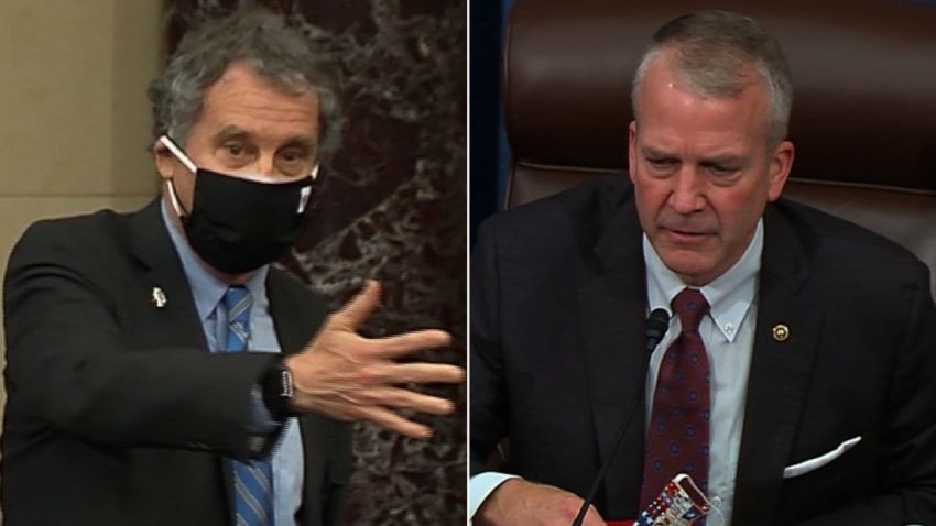 Sherrod Brown Dan Sullivan mask fight senate split