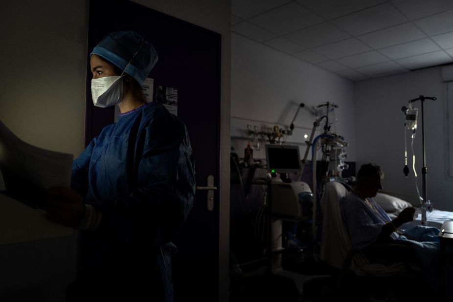 A medical worker looks away as she provides care to a Covid-19 patient in Saint-Etienne, France, on November 6.