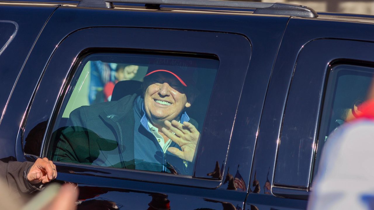 Trump waves to supporters protesting the results of the presidential election, as the presidential motorcade drives by the "Million MAGA March" rally, at Freedom Plaza in Washington on Saturday, November 14.