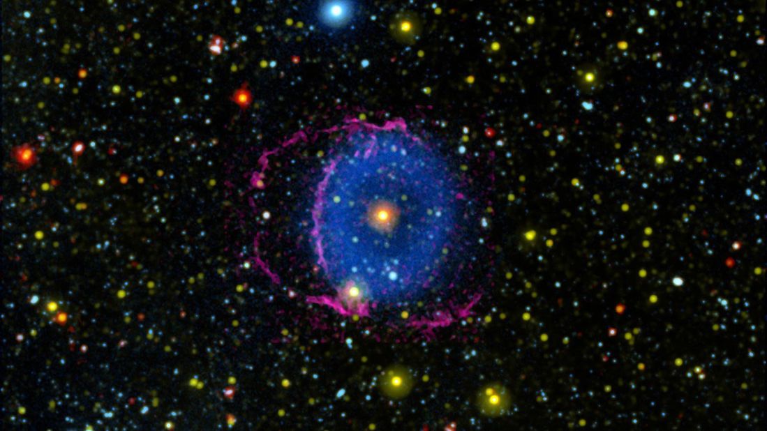 The Blue Ring Nebula is thought to be a never-before-seen phase that occurs after the merger of two stars. Debris flowing out from the merger was sliced by a disk around one of the stars, creating two cones of material glowing in ultraviolet light.