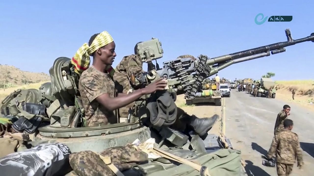 This image, made from undated handout video released by the state-owned Ethiopian News Agency on November 16, 2020, shows Ethiopian military in an armored personnel carrier near the border of the Tigray and Amhara regions of Ethiopia. 